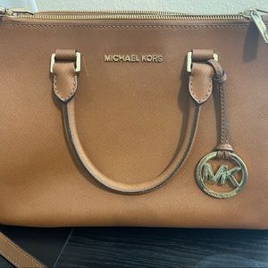 Michael Kors light brown with gold accents purse.